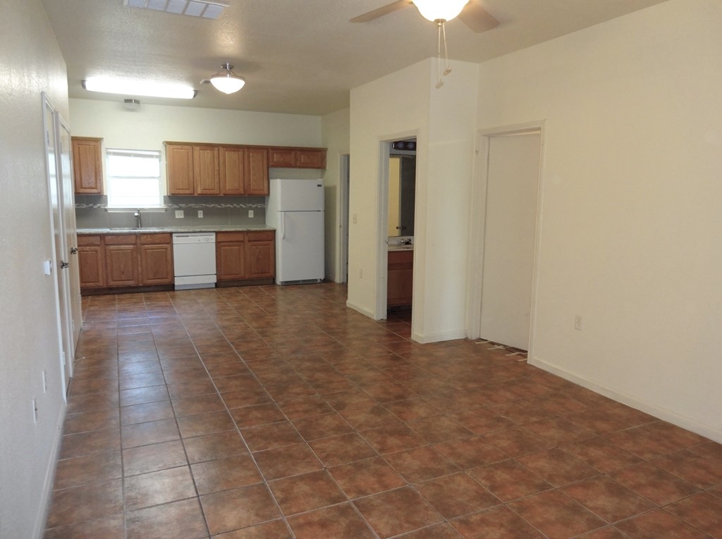 4704 Ledesma Road, Unit A & B Austin, TX 78721 - Photo 3 of 24 a view of a kitchen with a sink and a refrigerator