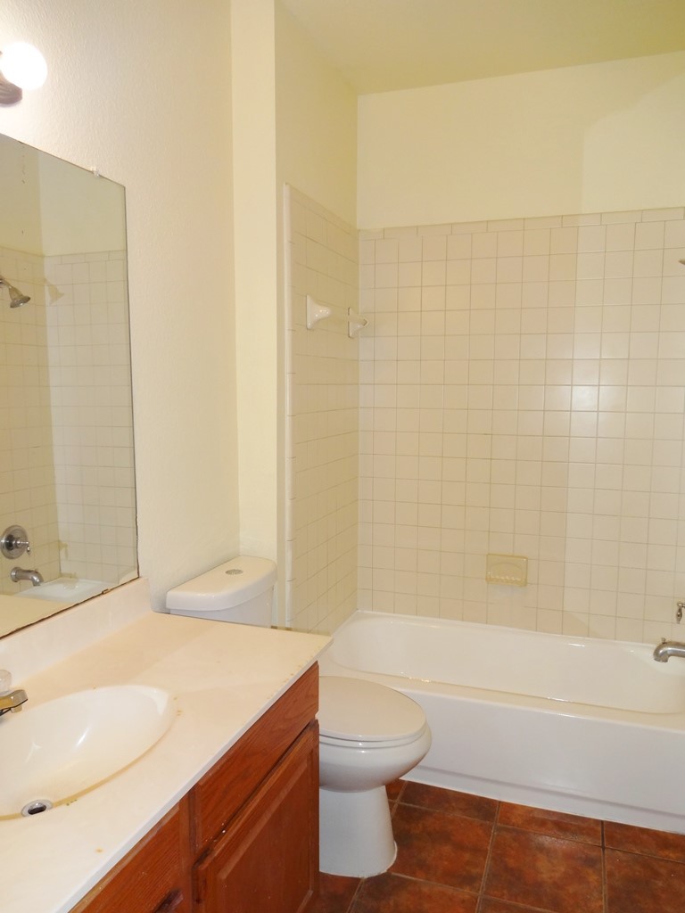 4704 Ledesma Road, Unit A & B Austin, TX 78721 - Photo 6 of 24 a bathroom with a sink a toilet and shower