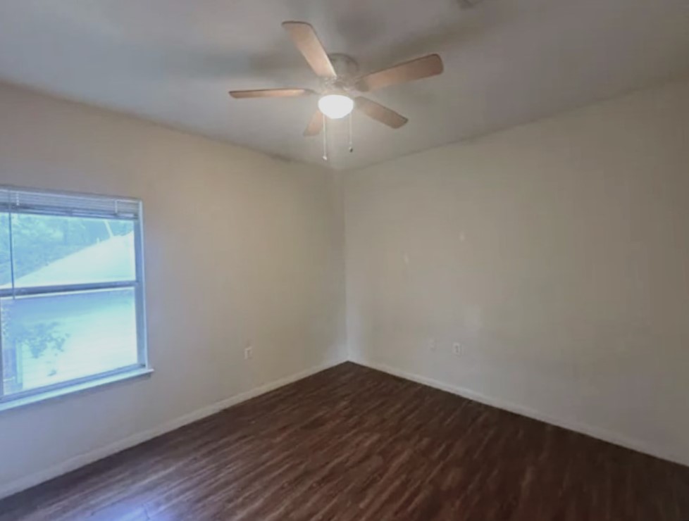 4704 Ledesma Road, Unit A & B Austin, TX 78721 - Photo 10 of 24 an empty room with wooden floor and windows