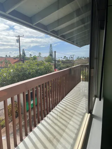 a room with cabinets and washer dryer