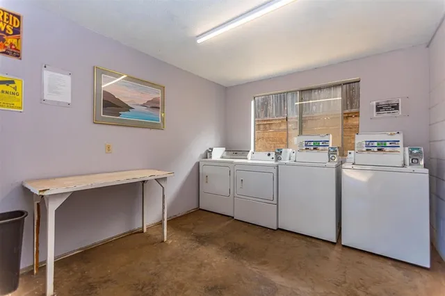 a view of a house with wooden deck