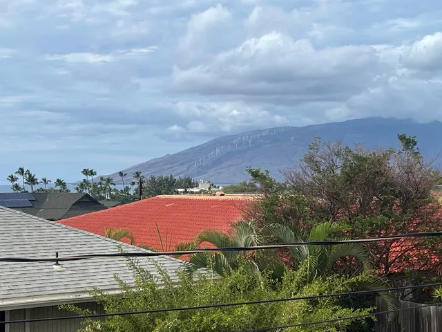 a view of a car park the front of house
