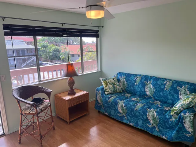a living room with furniture and a window