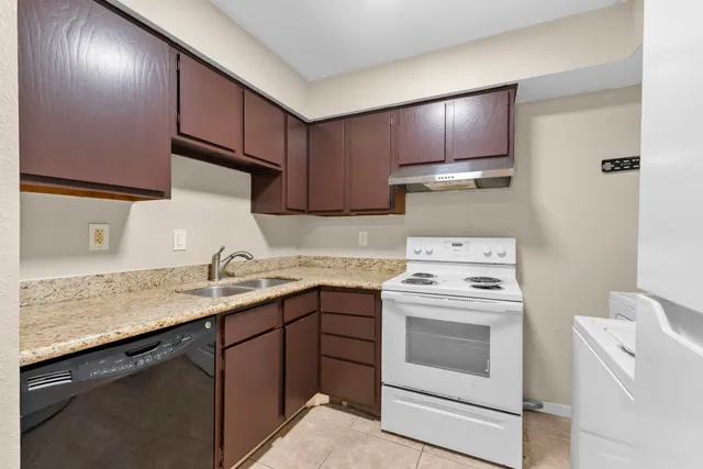 a white refrigerator freezer sitting inside of a kitchen