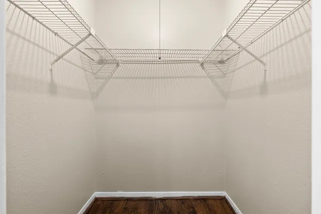 a bathroom with a granite countertop sink a toilet and a bathtub