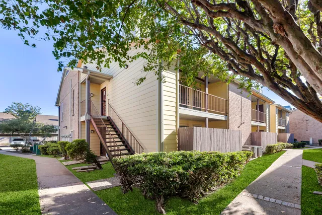 a house view with a garden space