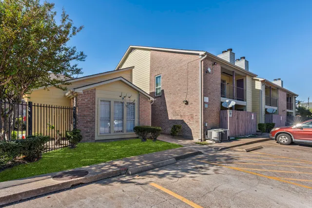 a view of a house with a yard and garage
