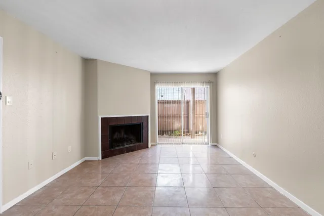 an empty room with fireplace