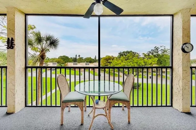 a view of a balcony with chairs