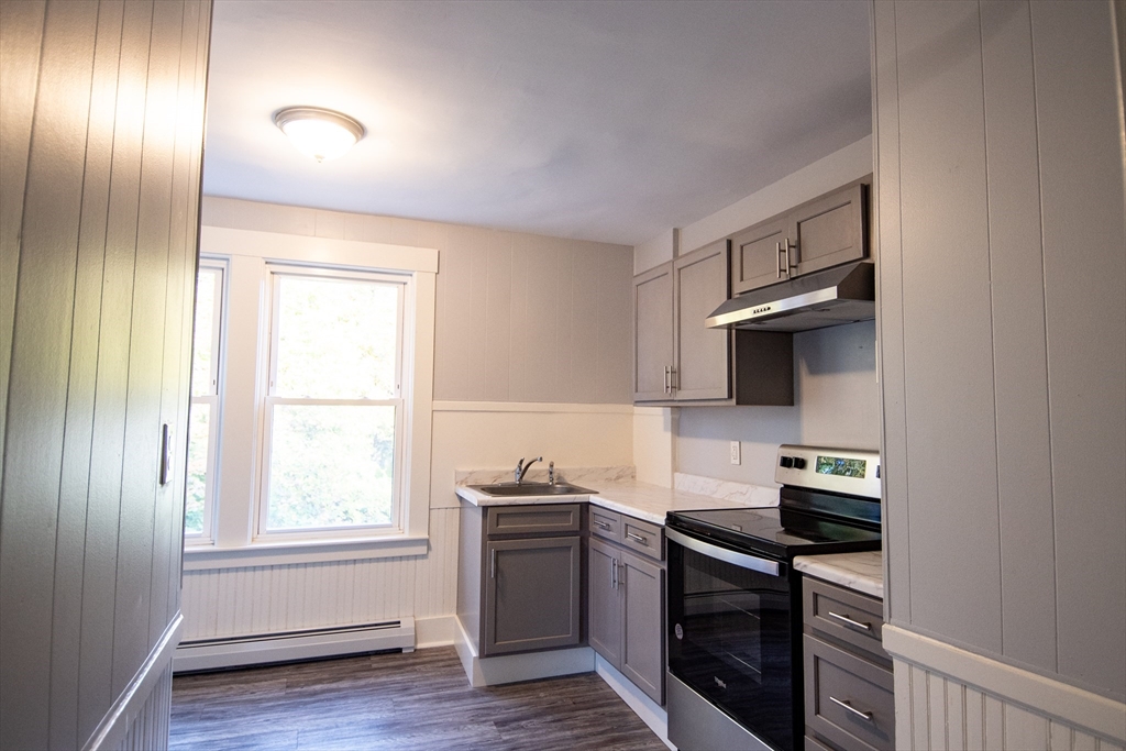 3 Bridge Street, Unit 2 Montague, MA 01349 - Photo 10 of 11 a kitchen with a sink and a stove top oven