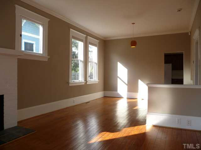 625 East Franklin Street Raleigh, NC 27604 - Photo 4 of 25 The bright loft-like openness offers options for configuring living and dining spaces adjacent to the kitchen. The fireplace is decorative.