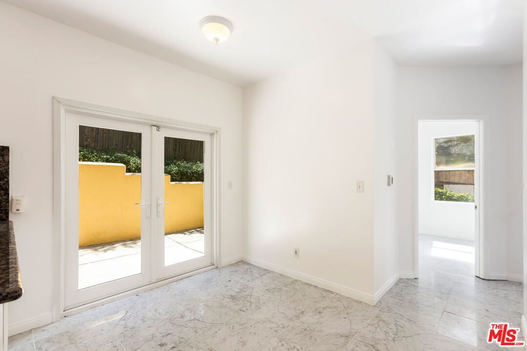 23636 Aster Trail Calabasas, CA 91302 - Photo 12 of 67 an empty room with glass door and windows