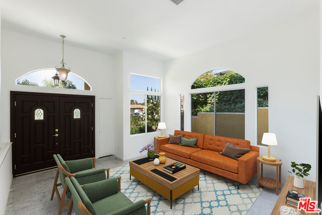 23636 Aster Trail Calabasas, CA 91302 - Photo 2 of 67 a living room with furniture and a chandelier