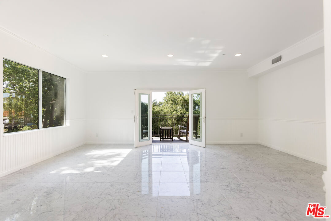 23636 Aster Trail Calabasas, CA 91302 - Photo 32 of 67 a view of an empty room with a balcony