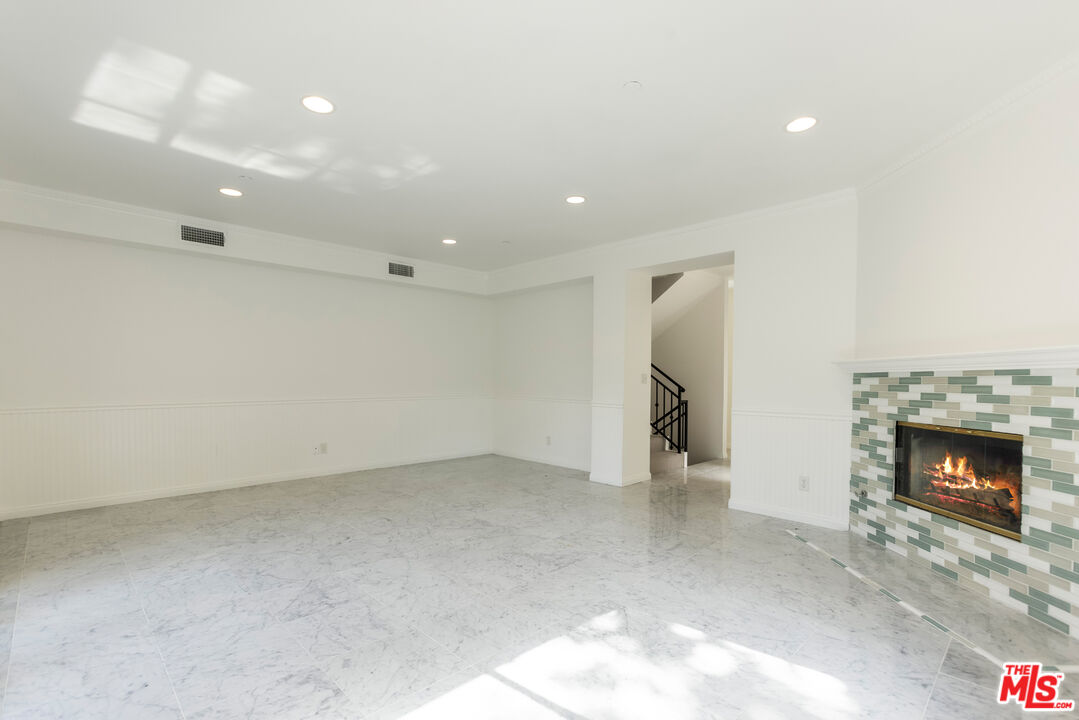 23636 Aster Trail Calabasas, CA 91302 - Photo 36 of 67 a view of an empty room with a fireplace