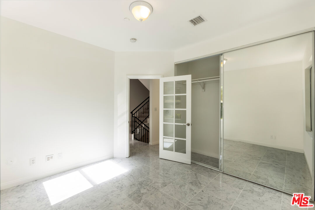 23636 Aster Trail Calabasas, CA 91302 - Photo 38 of 67 an empty room with walk in closet and window