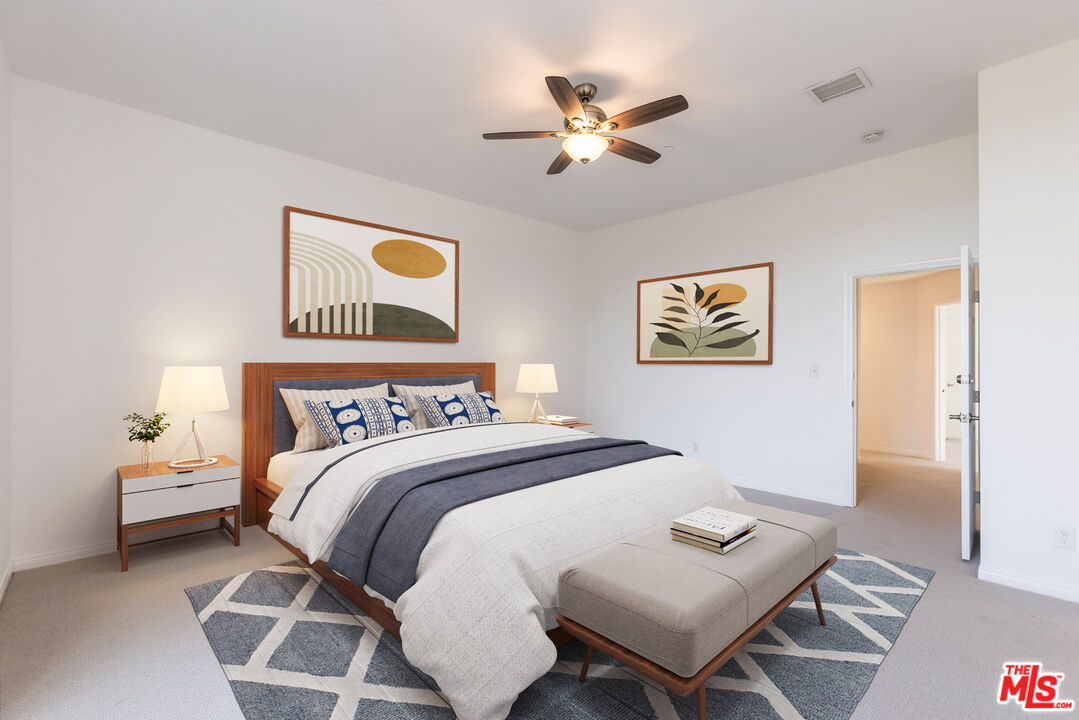 23636 Aster Trail Calabasas, CA 91302 - Photo 46 of 67 a bedroom with a bed and a chandelier