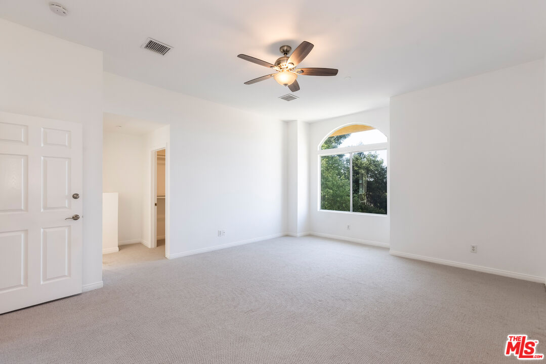 23636 Aster Trail Calabasas, CA 91302 - Photo 47 of 67 a view of a livingroom with a ceiling fan and window
