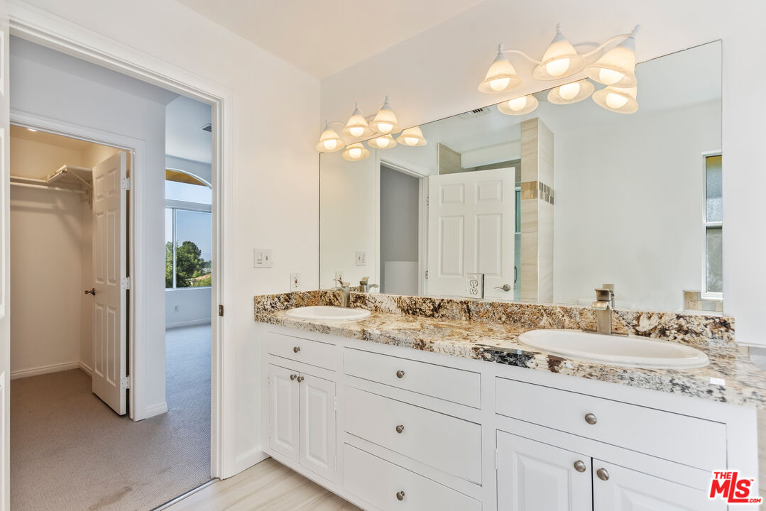 23636 Aster Trail Calabasas, CA 91302 - Photo 49 of 67 a bathroom with a sink double vanity and a mirror