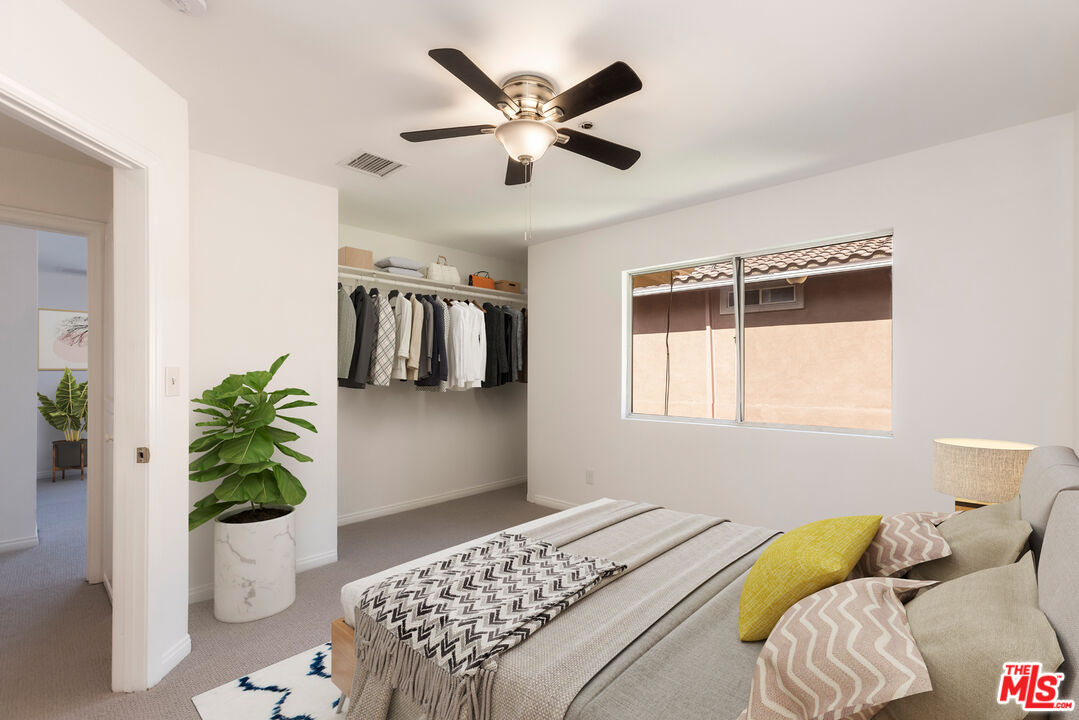 23636 Aster Trail Calabasas, CA 91302 - Photo 61 of 67 a bedroom with a bed and wooden floor