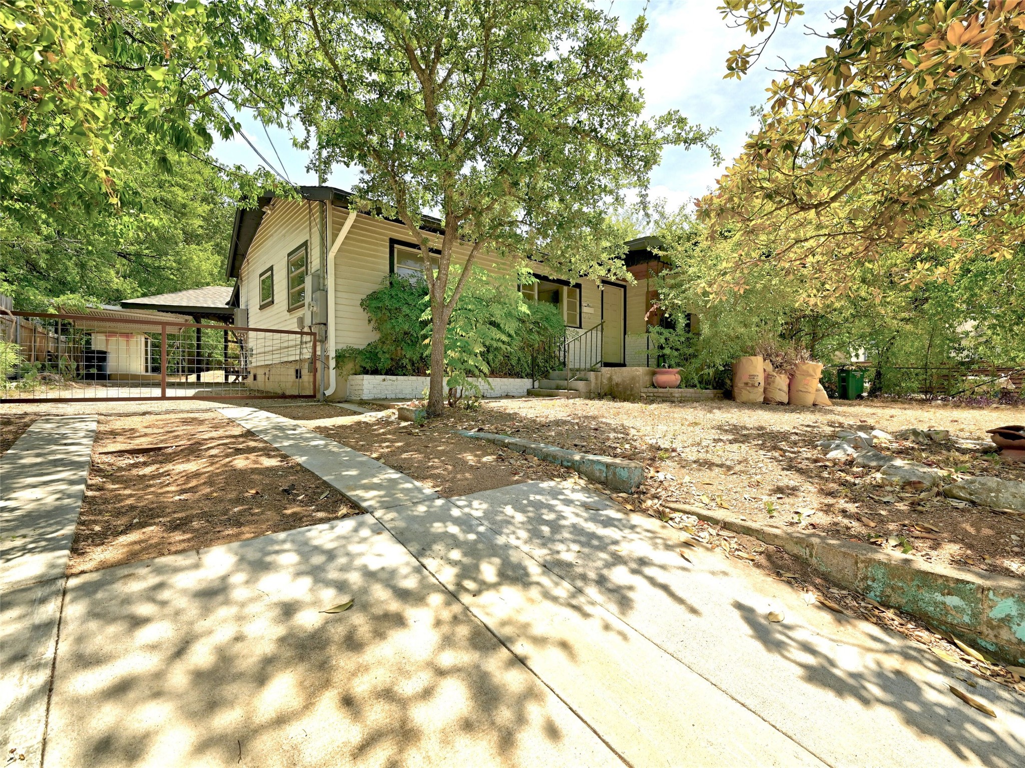 1181 Ridgeway Drive Austin, TX 78702 - Photo 1 of 1 a street view with large trees
