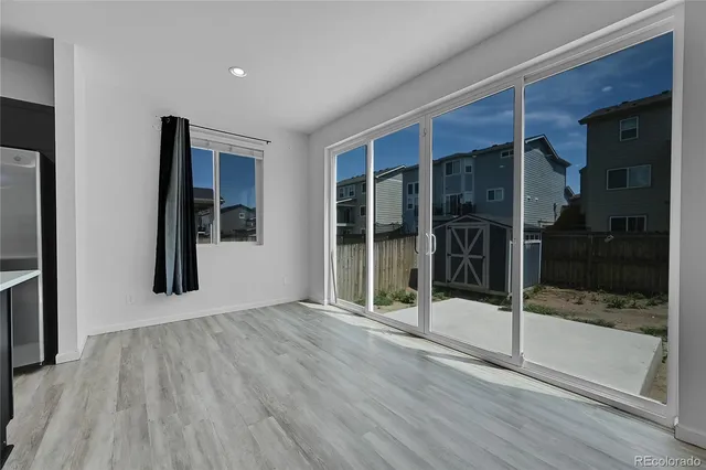 a view of a room with wooden floor and staircase