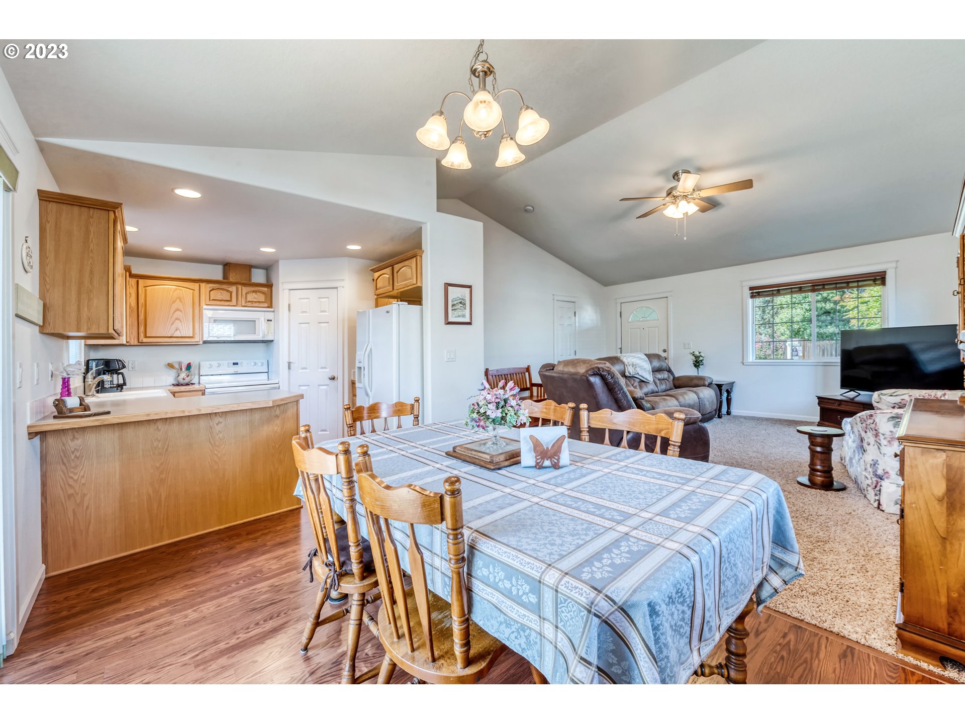 4659 Bluebelle Way Springfield, OR 97478 - Photo 8 of 32 a very nice looking dining room with kitchen island a table and a chair