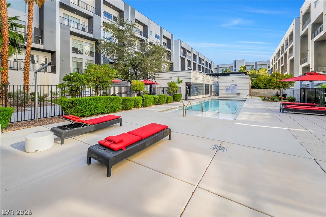 2775 West Pebble Road, Unit 505 Las Vegas, NV 89123 - Photo 25 of 26 An inviting outdoor pool with comfortable lounge chairs offers residents a refreshing escape.