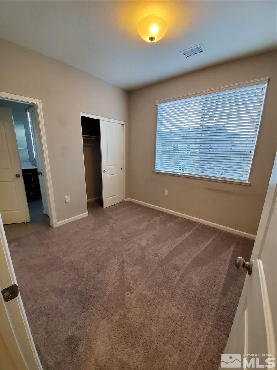 235 Mark Jeffrey Lane, Unit 101 Reno, NV 89503 - Photo 9 of 10 a view of an empty room with a window