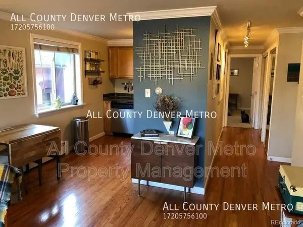 a kitchen with stainless steel appliances granite countertop a refrigerator a stove and a sink
