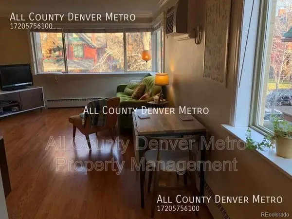 a view of a living room and a floor to ceiling window
