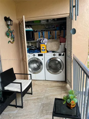 a kitchen with stainless steel appliances a refrigerator and a stove top oven