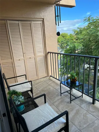 a view of a hallway with seating area