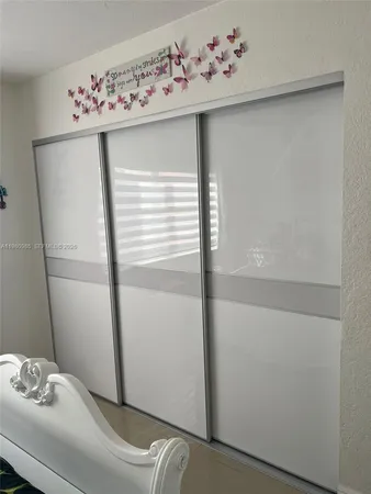a bathroom with a shower and toilet