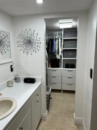 a living room with furniture and a black umbrella