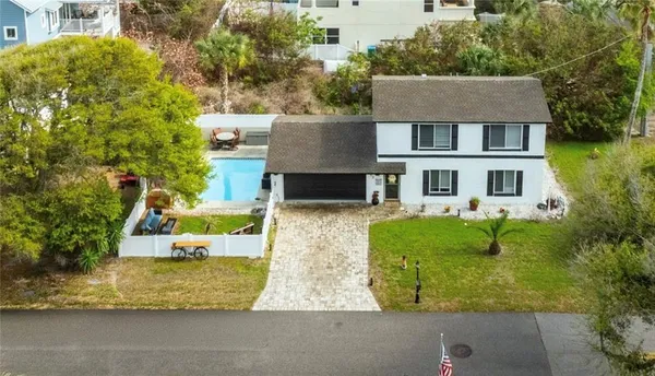 an aerial view of a house with garden