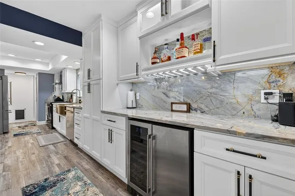 a kitchen with a sink and a stove top oven