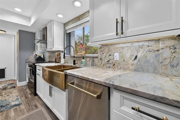 a kitchen with a sink and a refrigerator
