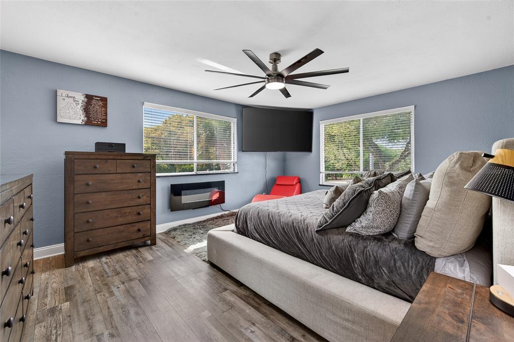 92 Alberta Avenue Ponce Inlet, FL 32127 - Photo 18 of 31 a bedroom with a bed and a window