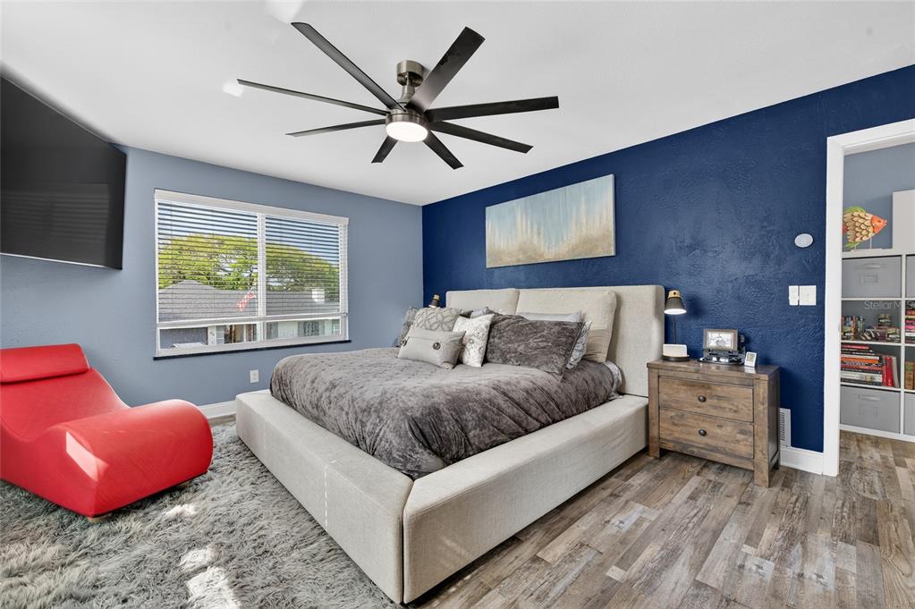 92 Alberta Avenue Ponce Inlet, FL 32127 - Photo 19 of 31 a spacious bedroom with a bed and window