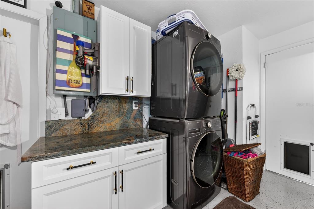 92 Alberta Avenue Ponce Inlet, FL 32127 - Photo 22 of 31 a utility room with dryer and washer