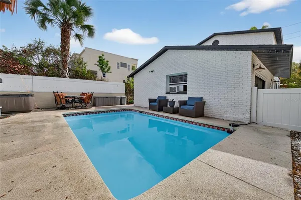 a view of a swimming pool with a patio