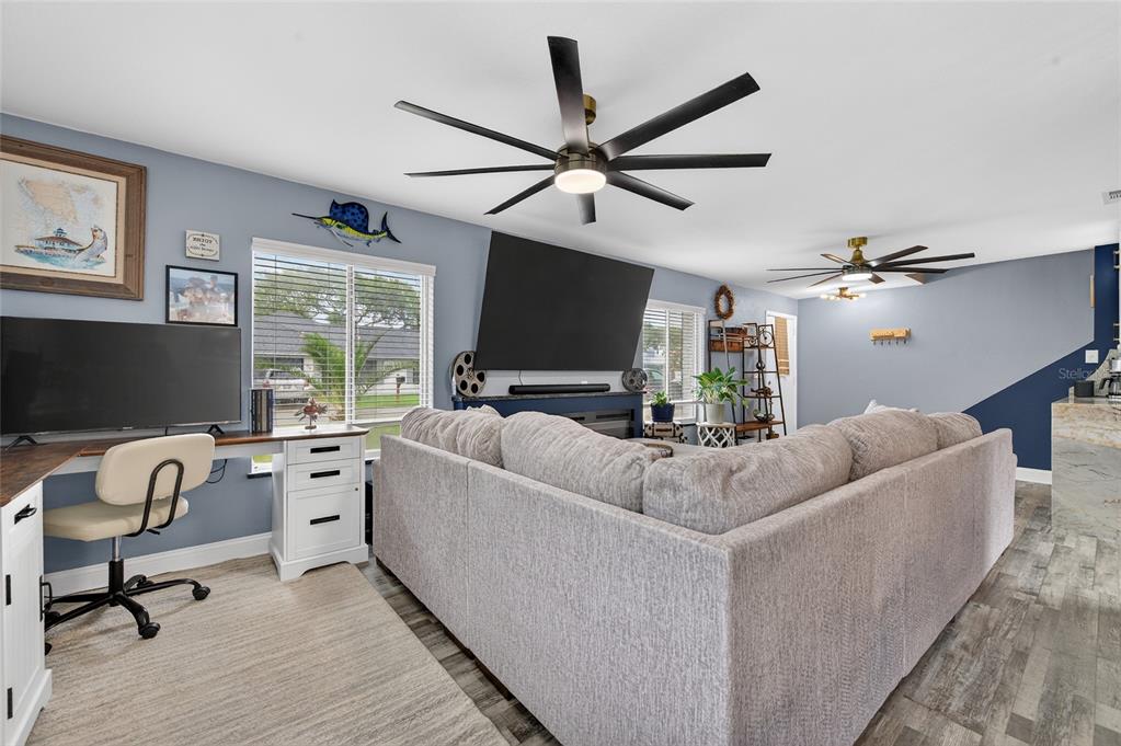 92 Alberta Avenue Ponce Inlet, FL 32127 - Photo 8 of 31 a living room with furniture and a flat screen tv