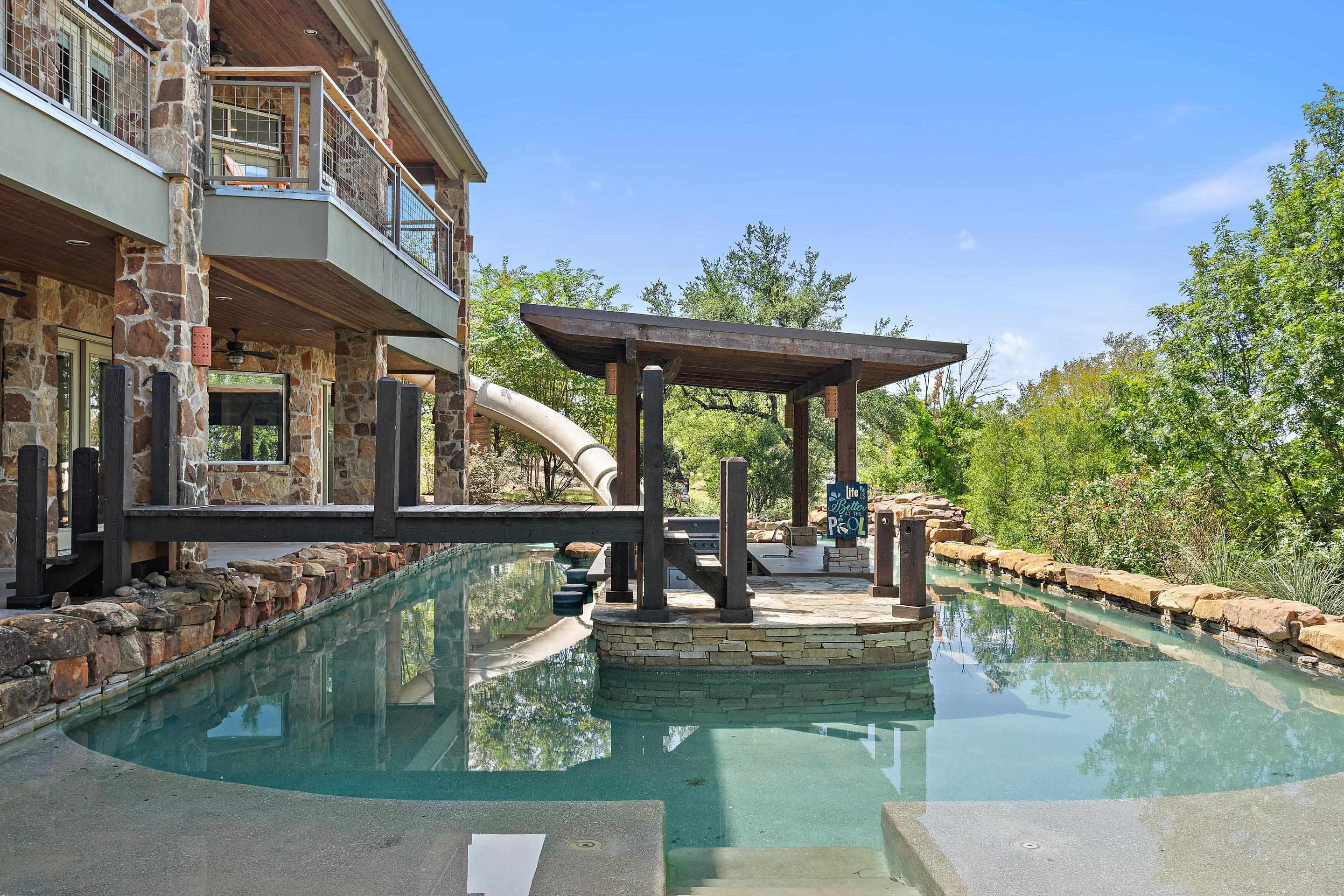 175 Scenic Ridge Drive Spicewood, TX 78669 - Photo 5 of 30 a view of swimming pool with outdoor seating