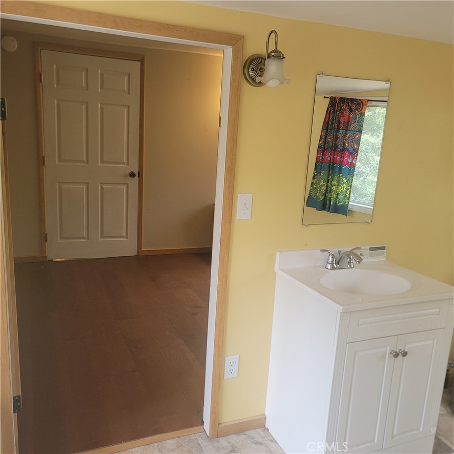 23340 Banning Idyllwild Idyllwild, CA 92549 - Photo 22 of 23 a bathroom with a sink and mirror