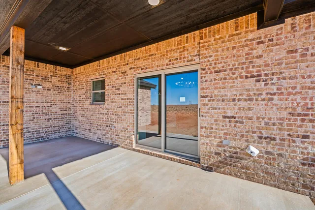 a view of front door of house with wooden floor