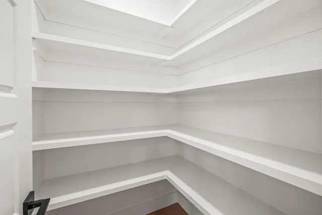 a view of an empty walk in closet