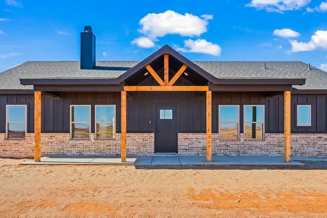 a front view of a house with yard