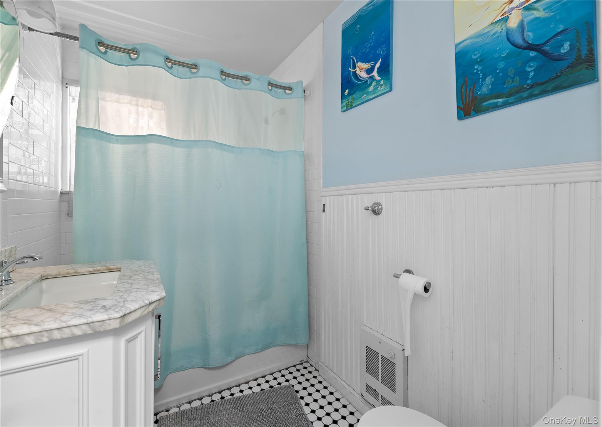 987 Surfview Walk Ocean Beach, NY 11770 - Photo 19 of 22 a bathroom with a granite countertop sink a toilet and a shower