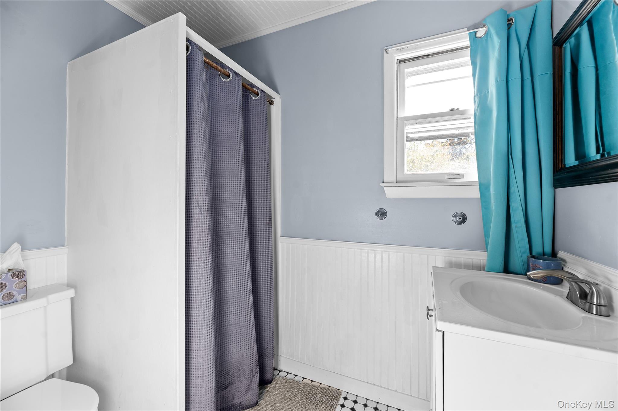 987 Surfview Walk Ocean Beach, NY 11770 - Photo 20 of 22 a bathroom with a sink toilet and tub